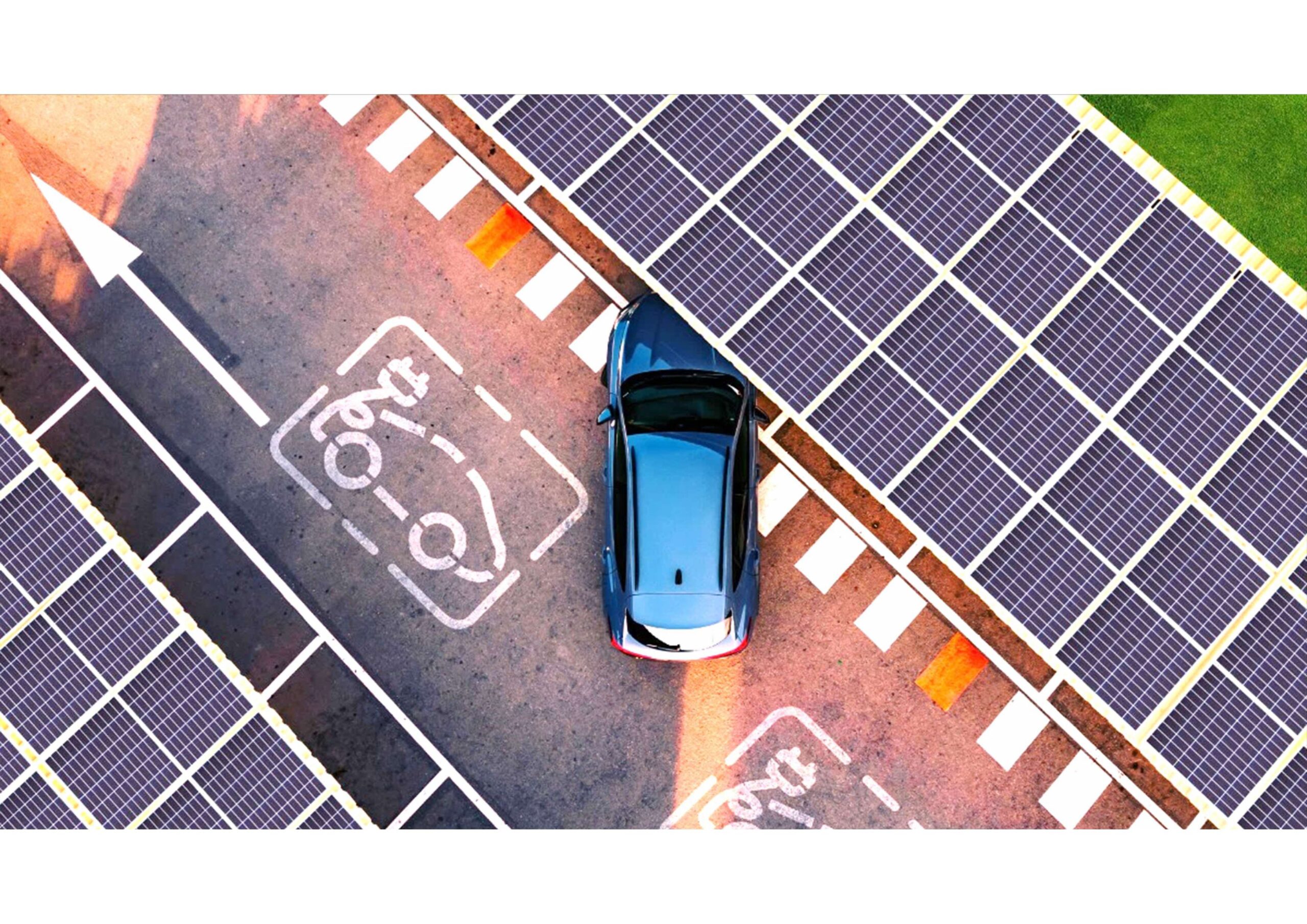 A blue car is parked under a solar panel roof in a designated electric vehicle charging space, photographed from above.