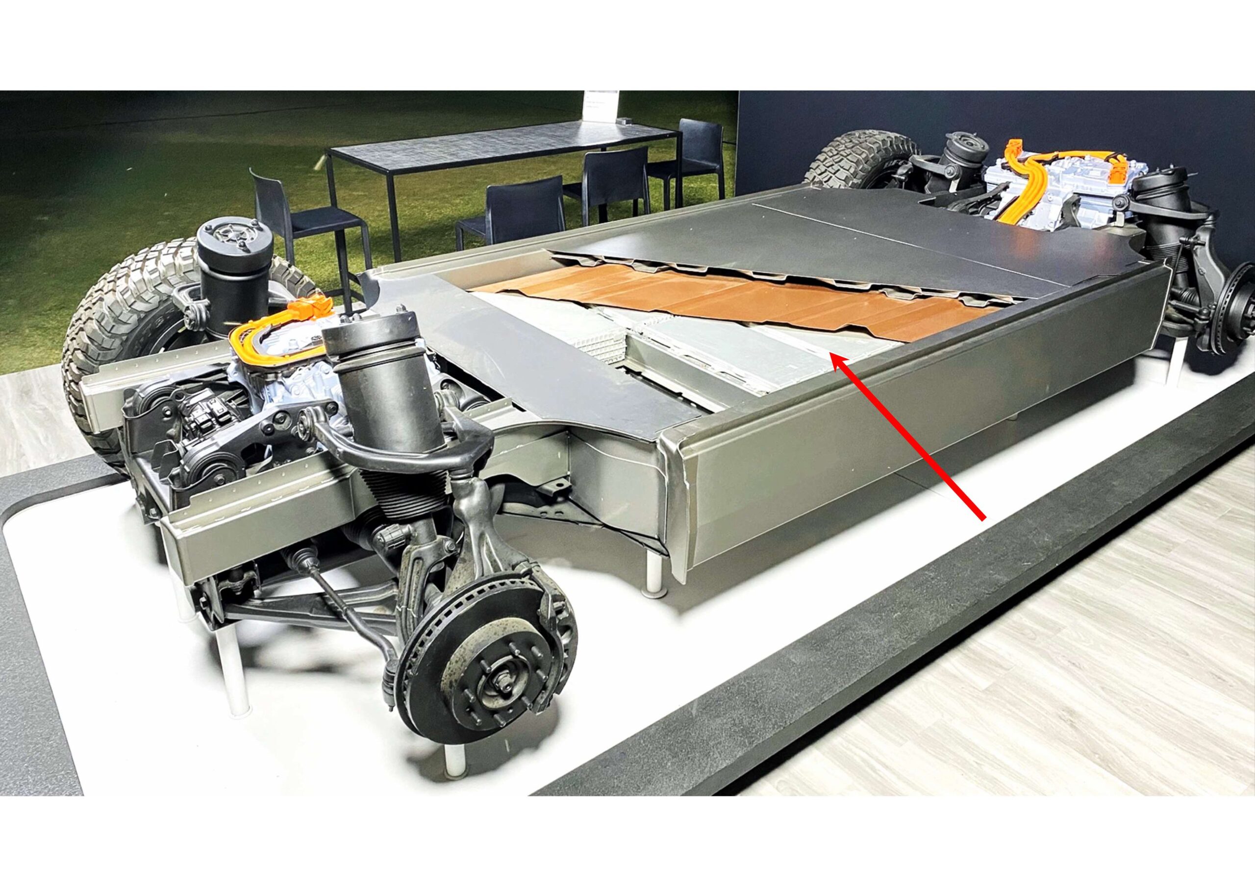 Text graphic with the heading "HEAVY EVs" and a statement about the strain heavier electric vehicles place on roads, bridges, and garages, as cars increase in size and weight.