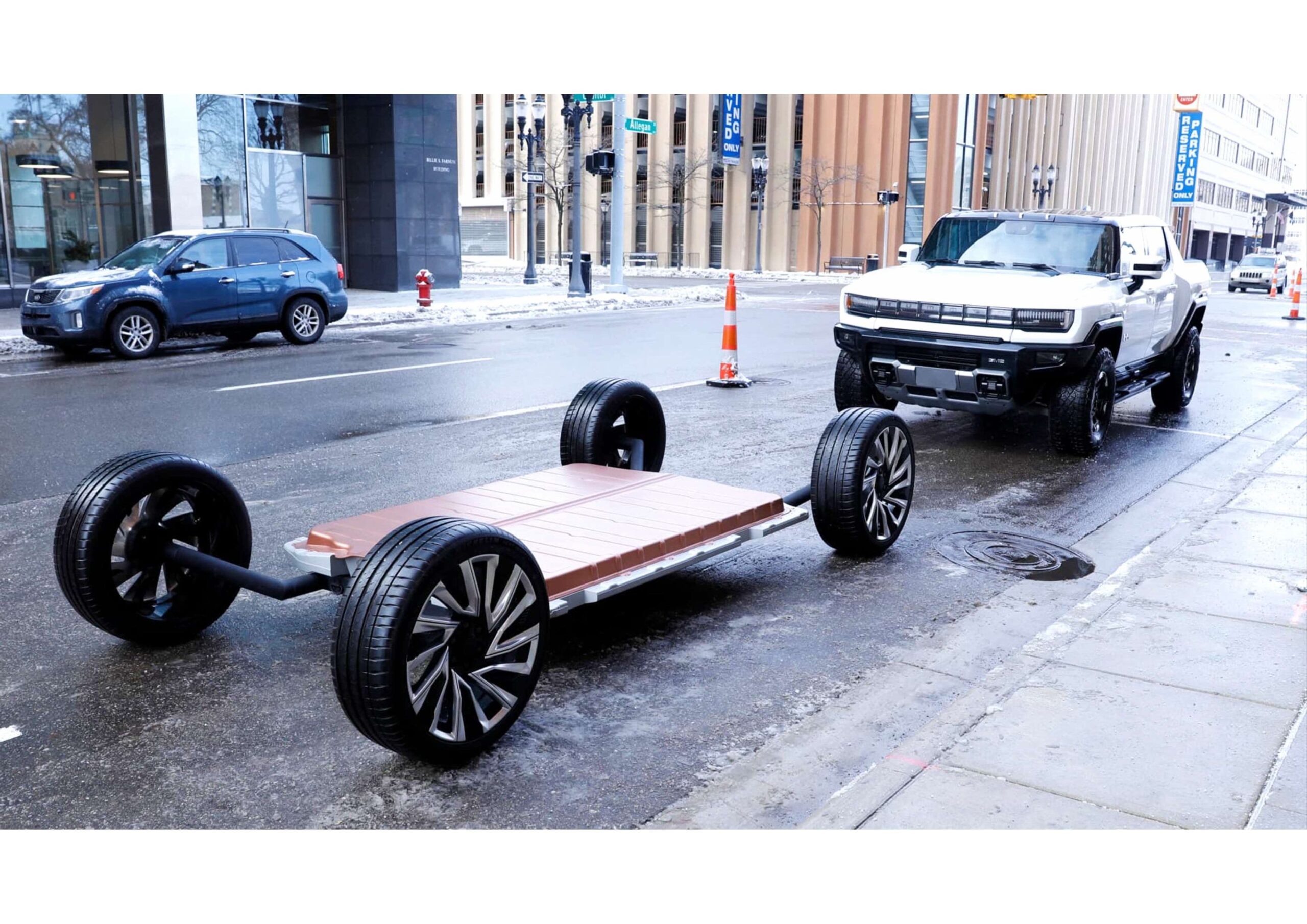 Two red Alfa Romeo sports cars, one vintage and one modern, are parked side by side on a tree-lined road in daylight.