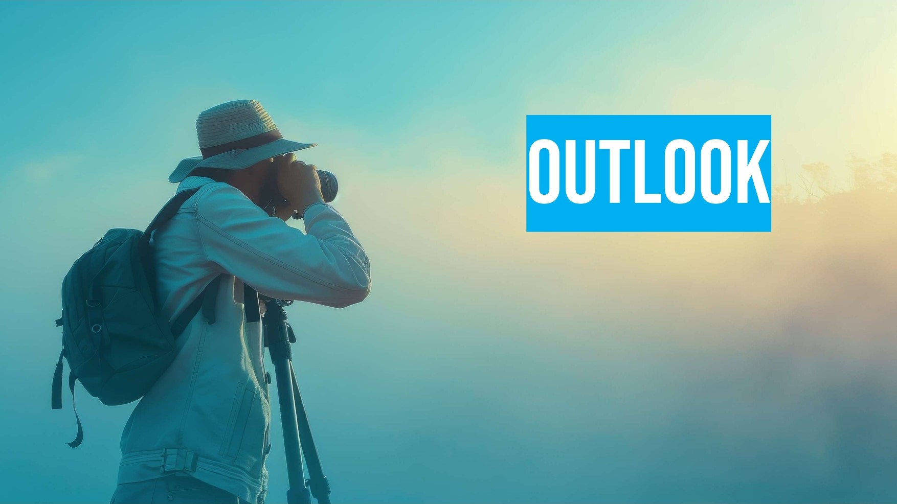 A person with a backpack and hat uses a camera on a tripod in a misty outdoor setting. The word "OUTLOOK" appears in bold text on the right.