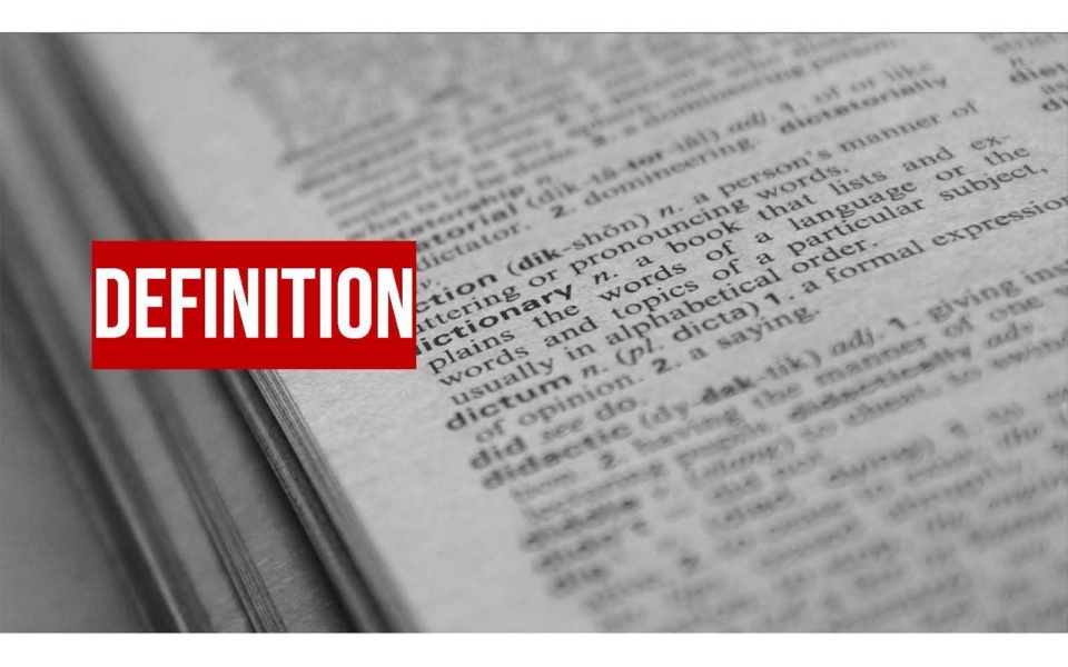 A close-up of an open dictionary page with the word "DEFINITION" highlighted in bold white letters on a red background overlay.