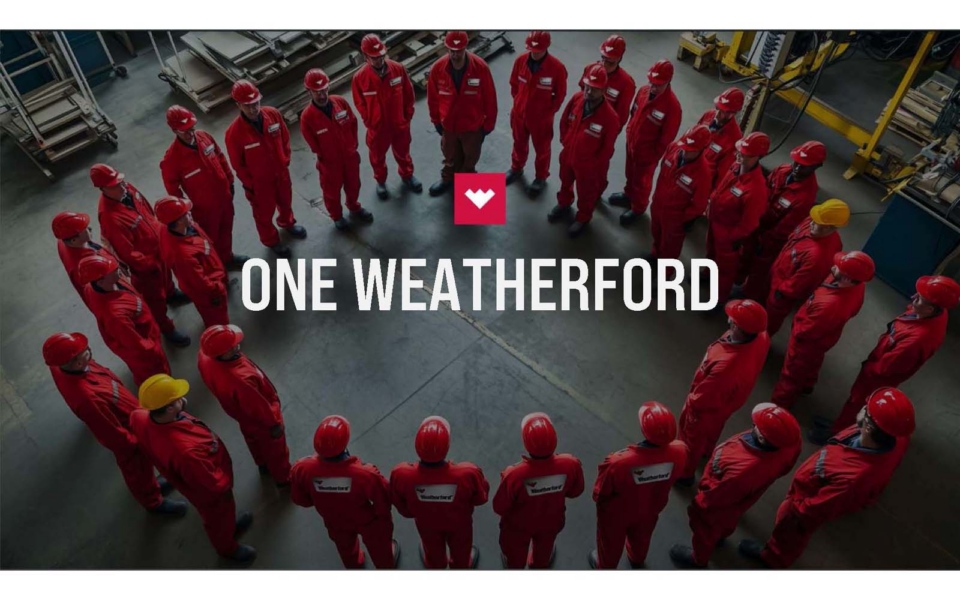 A group of workers in red uniforms and helmets stand in a circle around the "One Weatherford" logo in an industrial setting.