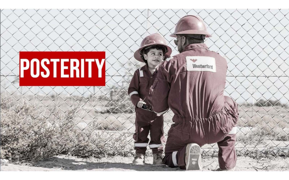 An adult and a child in matching maroon work uniforms and helmets stand by a chain-link fence; the word "POSTERITY" appears in bold red text on the left.