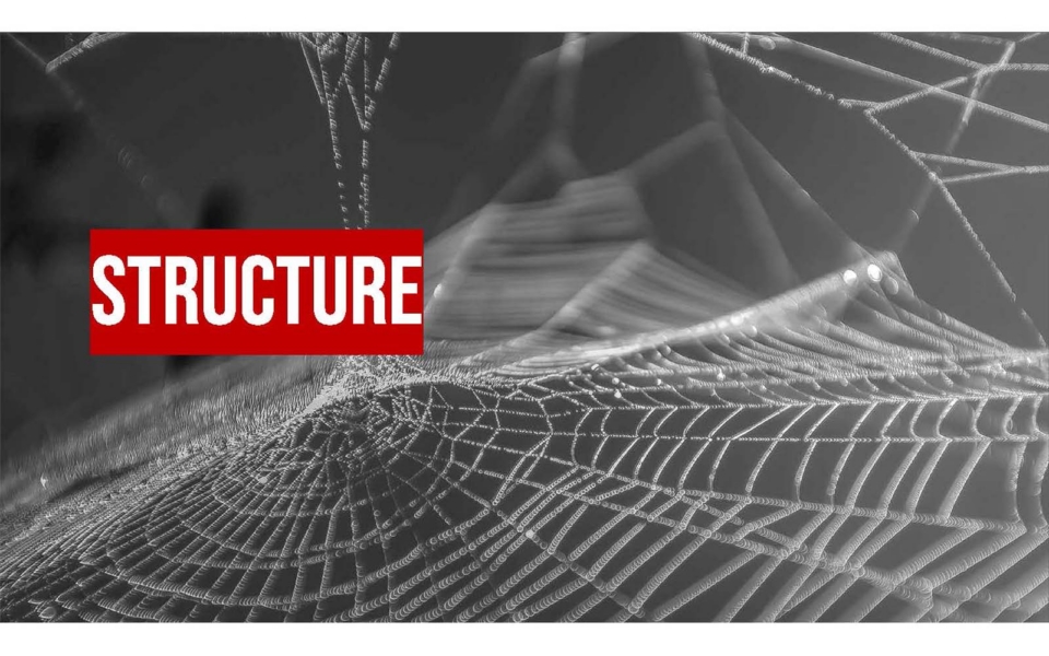 A close-up of a spider web with the word "STRUCTURE" in bold white letters on a red rectangle overlaying part of the web.